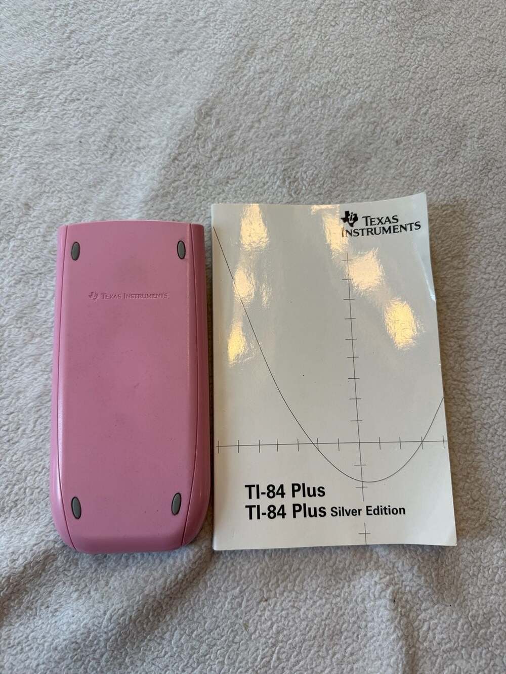 Texas Instruments TI-84 Plus Silver Edition Graphing Calculator with manual